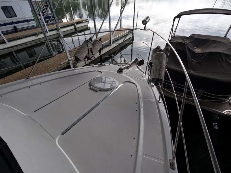Slide: The Image of 2001 Carver 444 Cockpit Motor Yacht bow view at marina. - 39