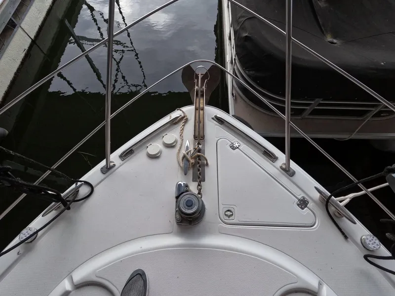 Slide: The Image of Bow of a 2001 Carver 444 Cockpit Motor Yacht docked at a marina. - 40