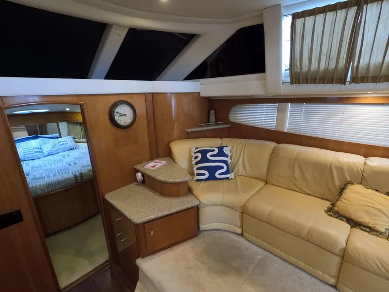 Slide: The Image of Interior of 2001 Carver 444 Cockpit Motor Yacht with beige leather seating. - 45