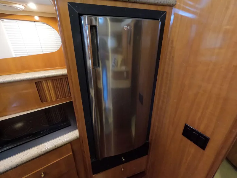 Slide: The Image of Stainless steel refrigerator in 2001 Carver 444 Cockpit Motor Yacht kitchen. - 49