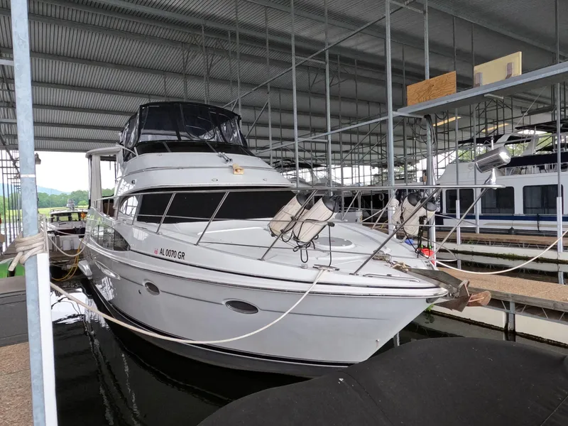 Slide: The Image of 2001 Carver 444 Cockpit Motor Yacht docked in a covered marina. - 8