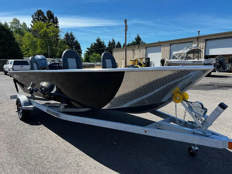 Slide: The Image of 2024 Fish Rite Angler boat on a trailer in a parking lot. - 14