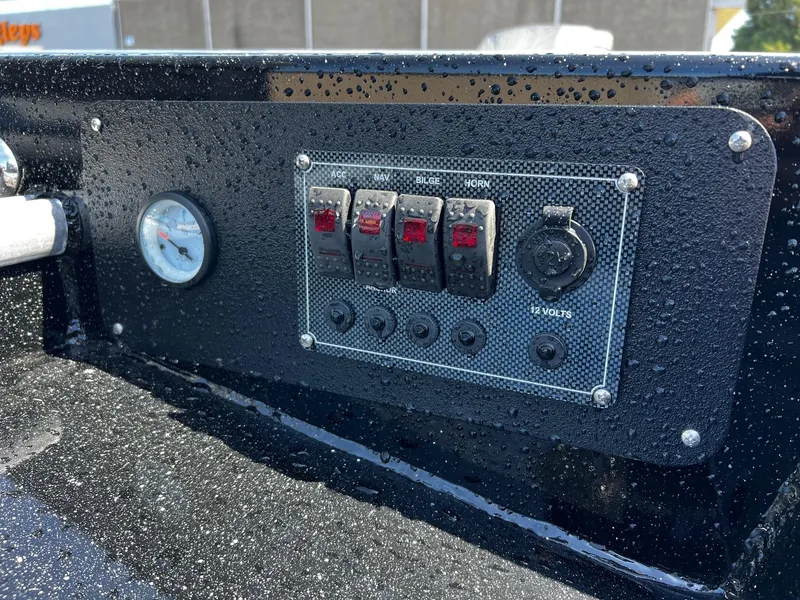 Slide: The Image of Control panel of 2024 Fish Rite Angler boat with switches and gauge. - 18