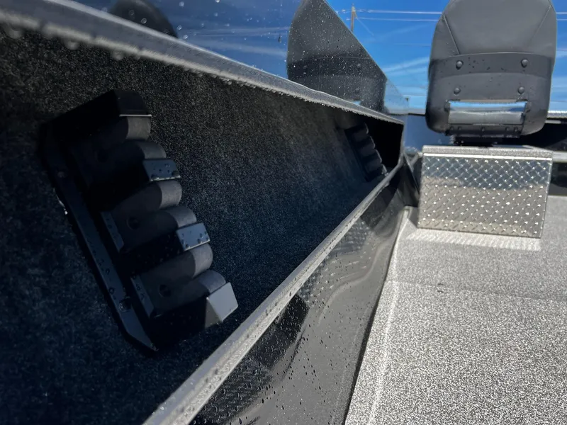 Slide: The Image of 2024 Fish Rite Angler boat interior with rod holders and seating. - 21
