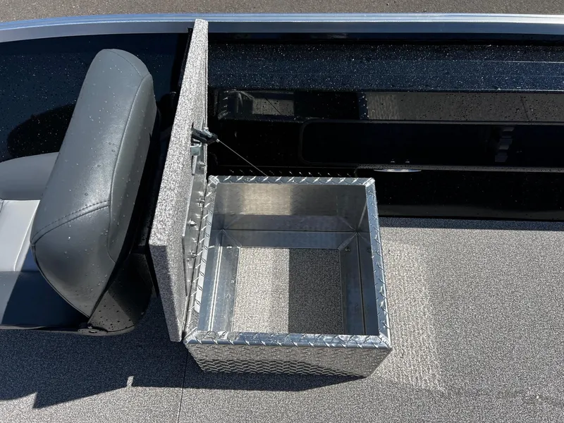 Slide: The Image of 2024 Fish Rite Angler boat with open storage compartment and seat. - 24