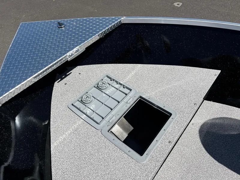 Slide: The Image of 2024 Fish Rite Angler boat with open storage compartments. - 26