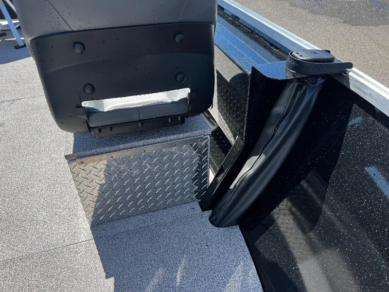 Slide: The Image of 2024 Fish Rite Angler boat interior with diamond plate flooring and seat base. - 27