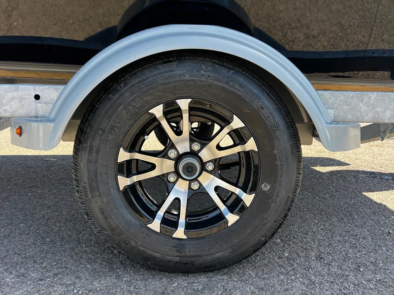 Slide: The Image of 2024 Fish Rite Angler trailer wheel with black and silver alloy rim. - 29