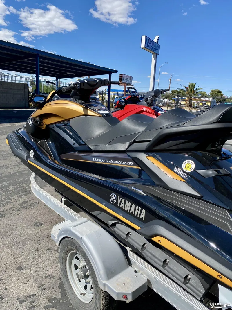 Slide: The Image of 2024 Yamaha WaveRunner FX Limited SVHO on a trailer under a clear blue sky. - 2