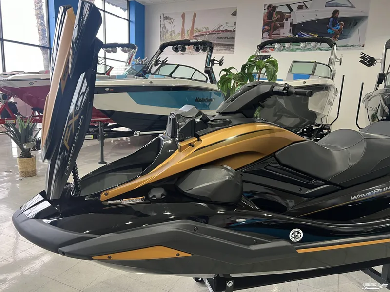 Slide: The Image of 2024 Yamaha WaveRunner FX Limited SVHO in showroom, surrounded by boats. - 6