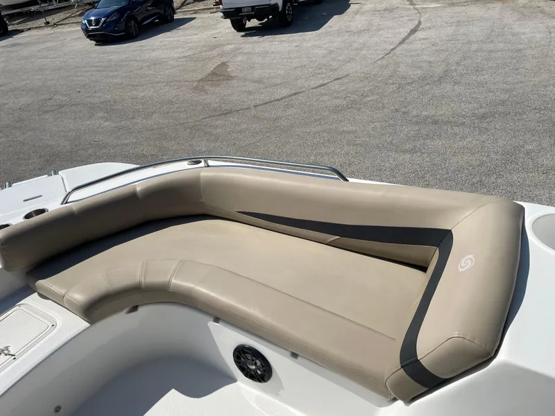 Slide: The Image of 2021 Hurricane SunDeck Sport 201 OB boat with beige seating and speaker on deck. - 12