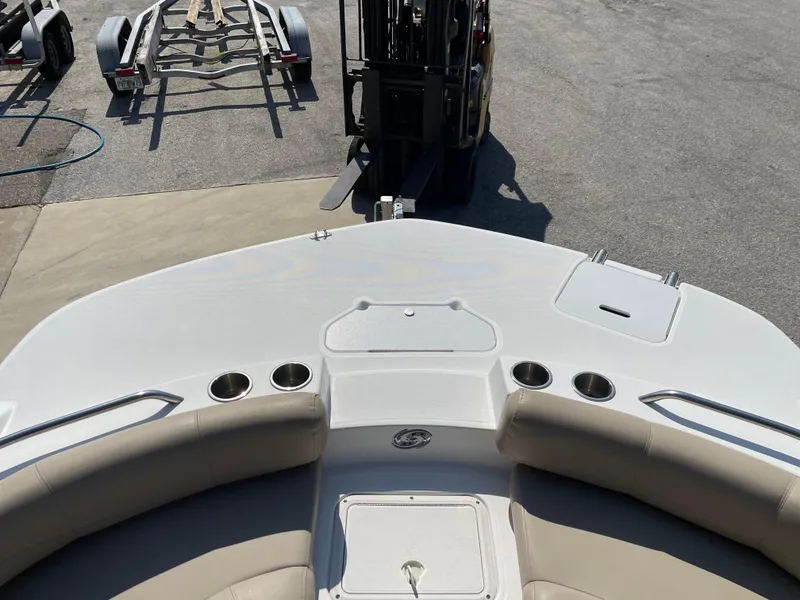 Slide: The Image of 2021 Hurricane SunDeck Sport 201 OB boat interior with cup holders and seating. - 13