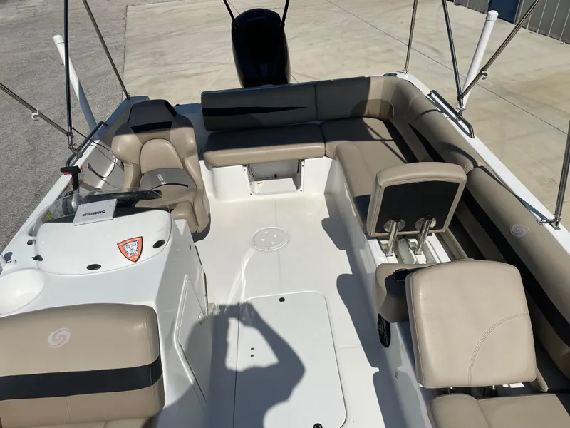 Slide: The Image of 2021 Hurricane SunDeck Sport 201 OB boat interior with beige seating and spacious layout. - 15