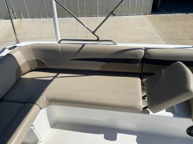 Slide: The Image of 2021 Hurricane SunDeck Sport 201 OB boat seating area with beige upholstery. - 17