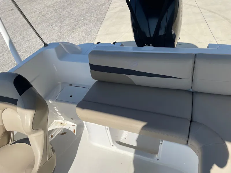 Slide: The Image of 2021 Hurricane SunDeck Sport 201 OB boat interior with beige seating and sleek design. - 18