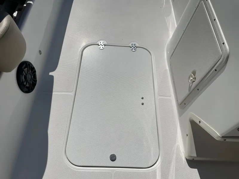 Slide: The Image of 2021 Hurricane SunDeck Sport 201 OB boat deck with storage hatch. - 25