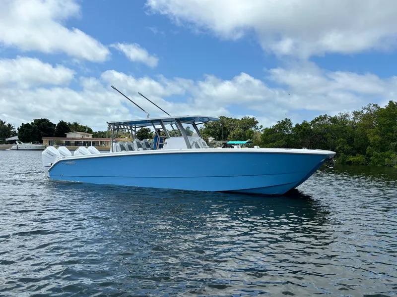 The Image of 2024 Invincible 40 Catamaran on calm water with blue sky background. - 0
