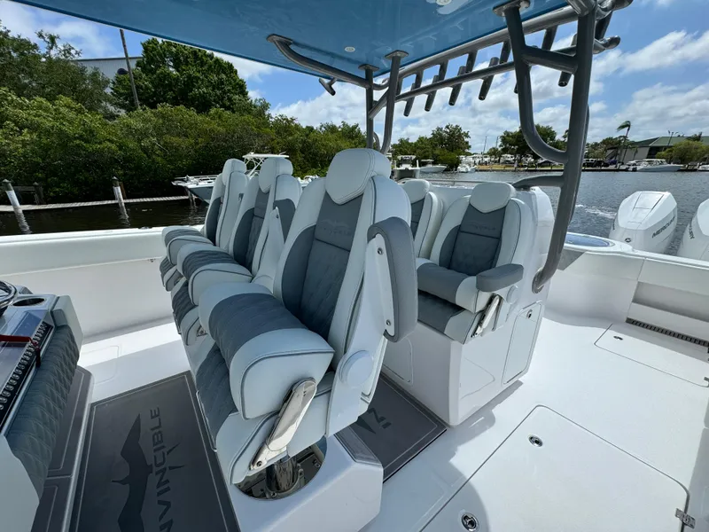Slide: The Image of 2024 Invincible 40 Catamaran boat with luxurious seating and modern design. - 13