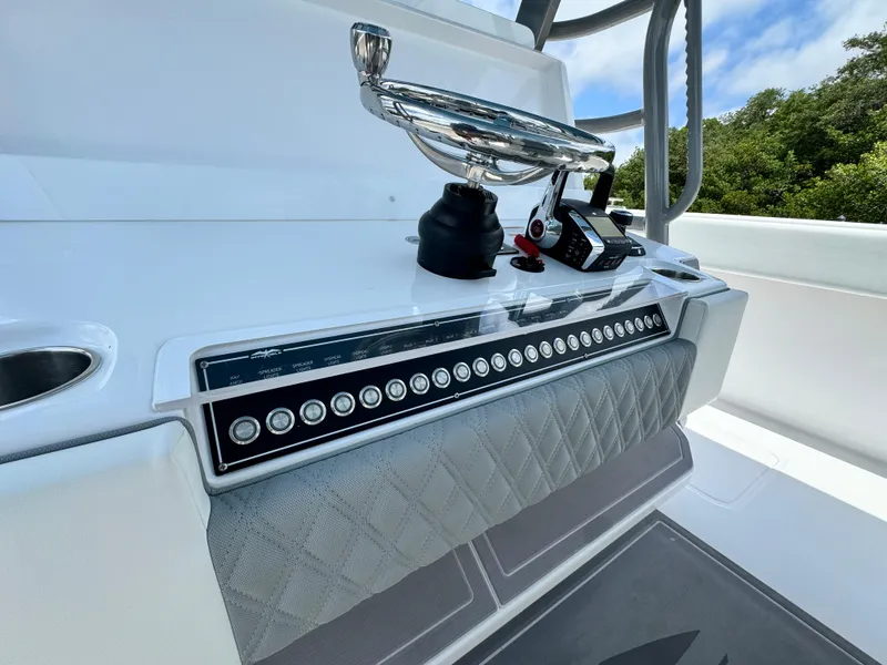 Slide: The Image of Control panel of 2024 Invincible 40 Catamaran with modern navigation equipment. - 17