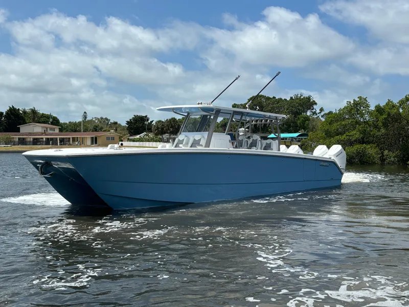 Slide: The Image of 2024 Invincible 40 Catamaran cruising on a sunny day. - 3