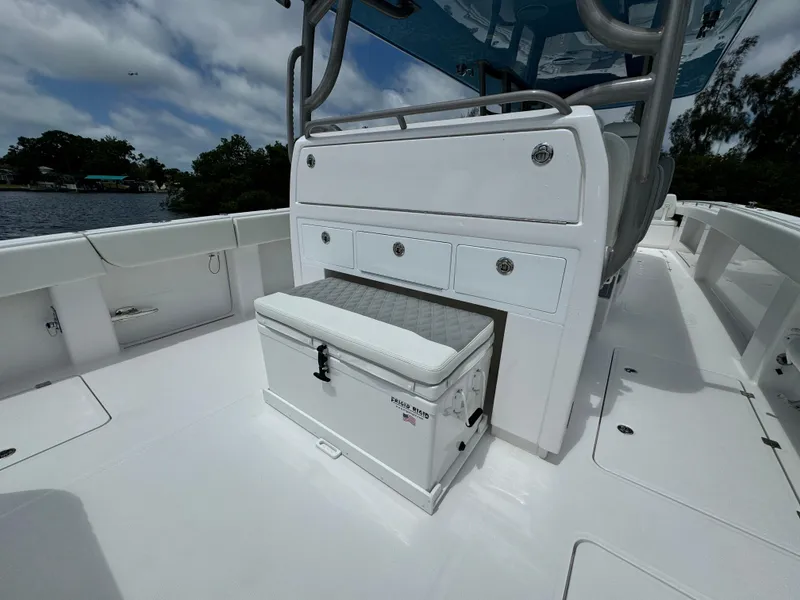 Slide: The Image of 2024 Invincible 40 Catamaran deck with storage compartments and cooler. - 9
