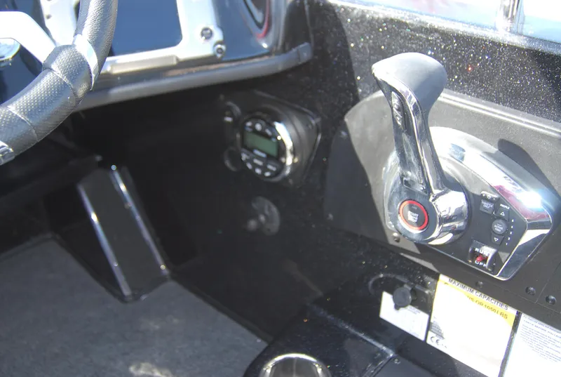 Slide: The Image of 2024 Nitro ZV19 Sport Pro boat control panel and throttle lever. - 10
