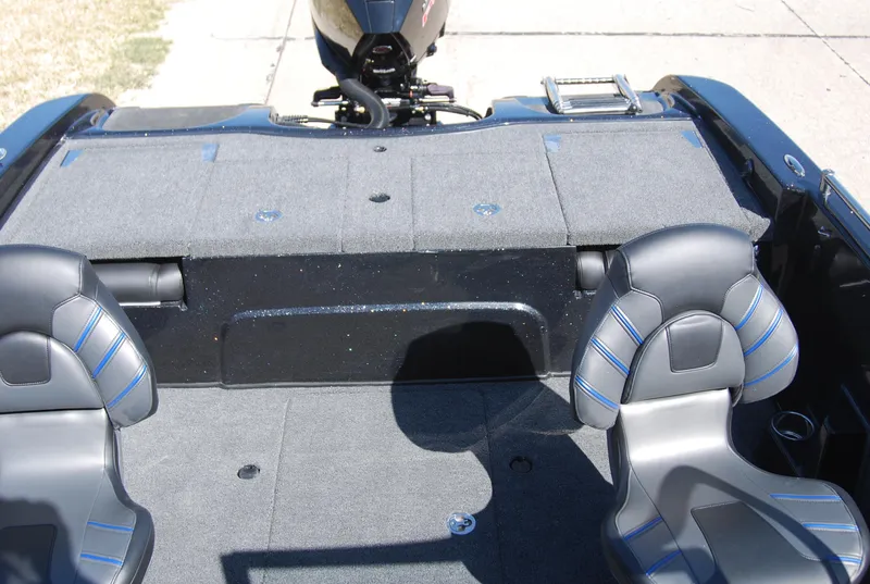 Slide: The Image of 2024 Nitro ZV19 Sport Pro boat interior with gray seating and carpeted deck. - 11