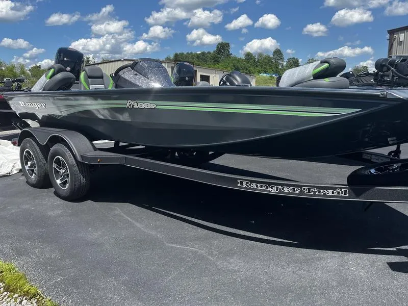The Image of 2024 Ranger RT188P fishing boat on a trailer under a sunny sky. - 0
