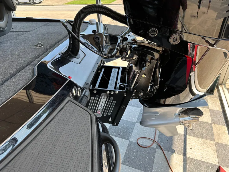 Slide: The Image of 2024 Triton 20XP Patriot boat engine and deck, showcasing sleek design and advanced features. - 9