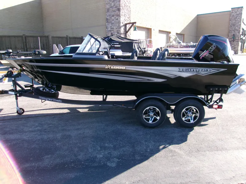 Slide: The Image of 2024 Ranger VX1888 WT boat on trailer, black exterior, parked outdoors. - 2