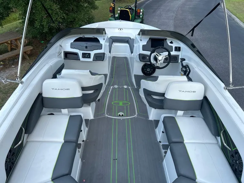 Slide: The Image of 2023 Tahoe 210 S Limited boat interior with white and gray seating. - 5