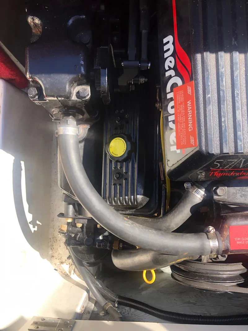 Slide: The Image of Engine compartment of a 1994 Sea Ray Overnighter boat, featuring MerCruiser components. - 36