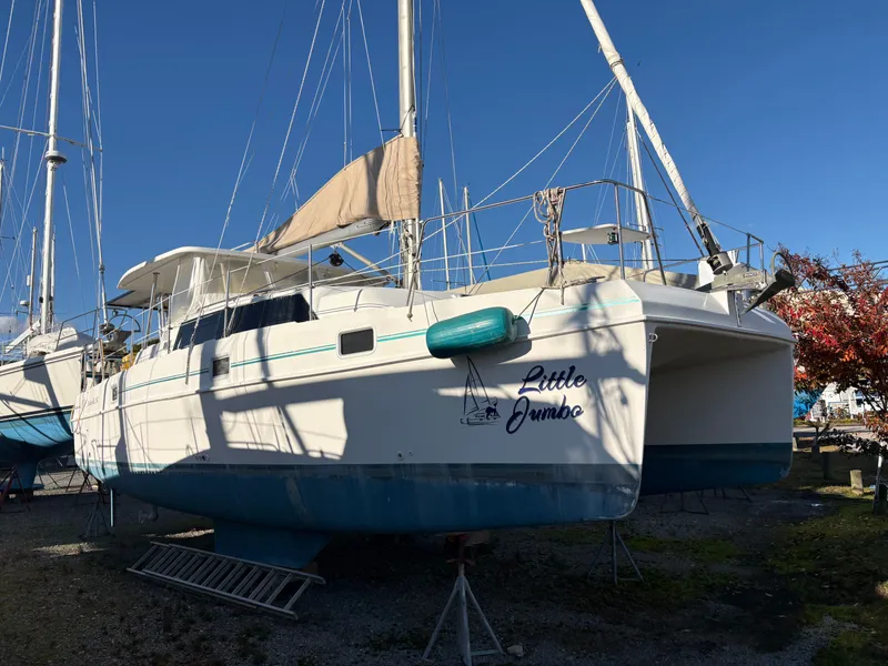 Slide: The Image of 2000 EndeavourCat 36 catamaran "Little Jumbo" on land, with blue sky background. - 4