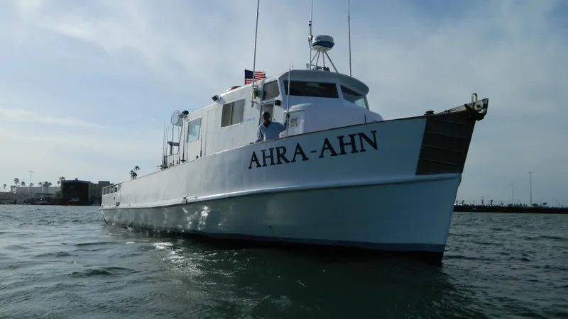 Slide: The Image of 1958 Ditmar & Donaldson sport boat "AHRA-AHN" on water, clear sky background. - 1