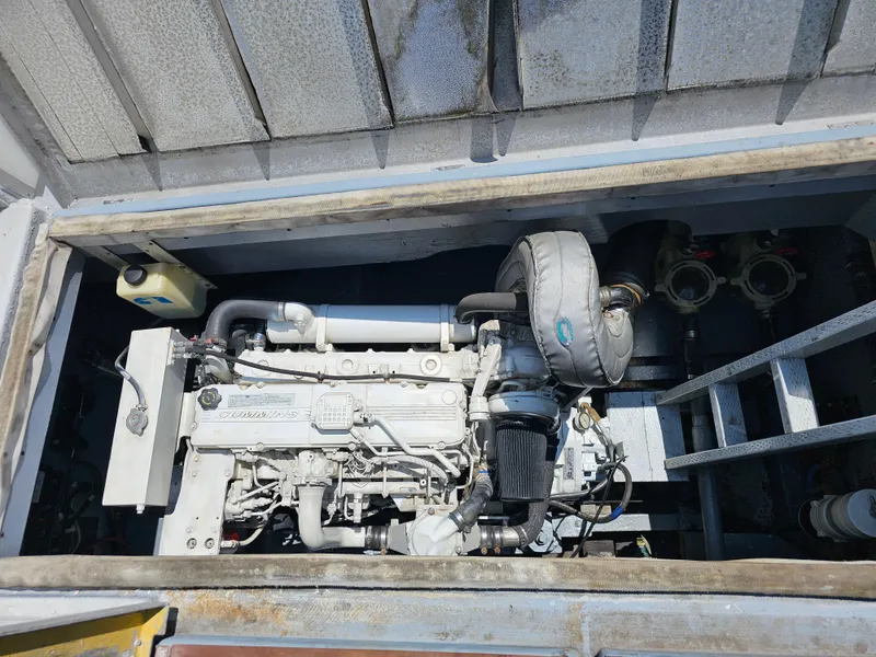 Slide: The Image of Engine compartment of a 1958 Ditmar & Donaldson Sport boat, showcasing mechanical components. - 12