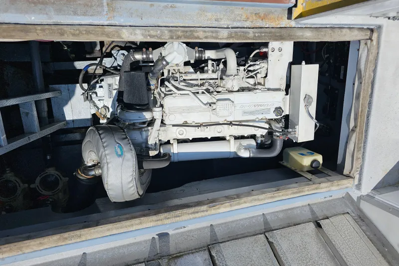 Slide: The Image of 1958 Ditmar & Donaldson Sport boat engine compartment with visible machinery and components. - 13