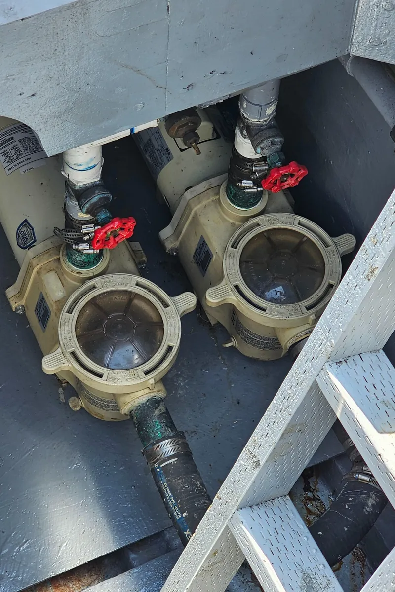 Slide: The Image of 1958 Ditmar & Donaldson Sport Boat engine compartment with dual water pumps. - 14