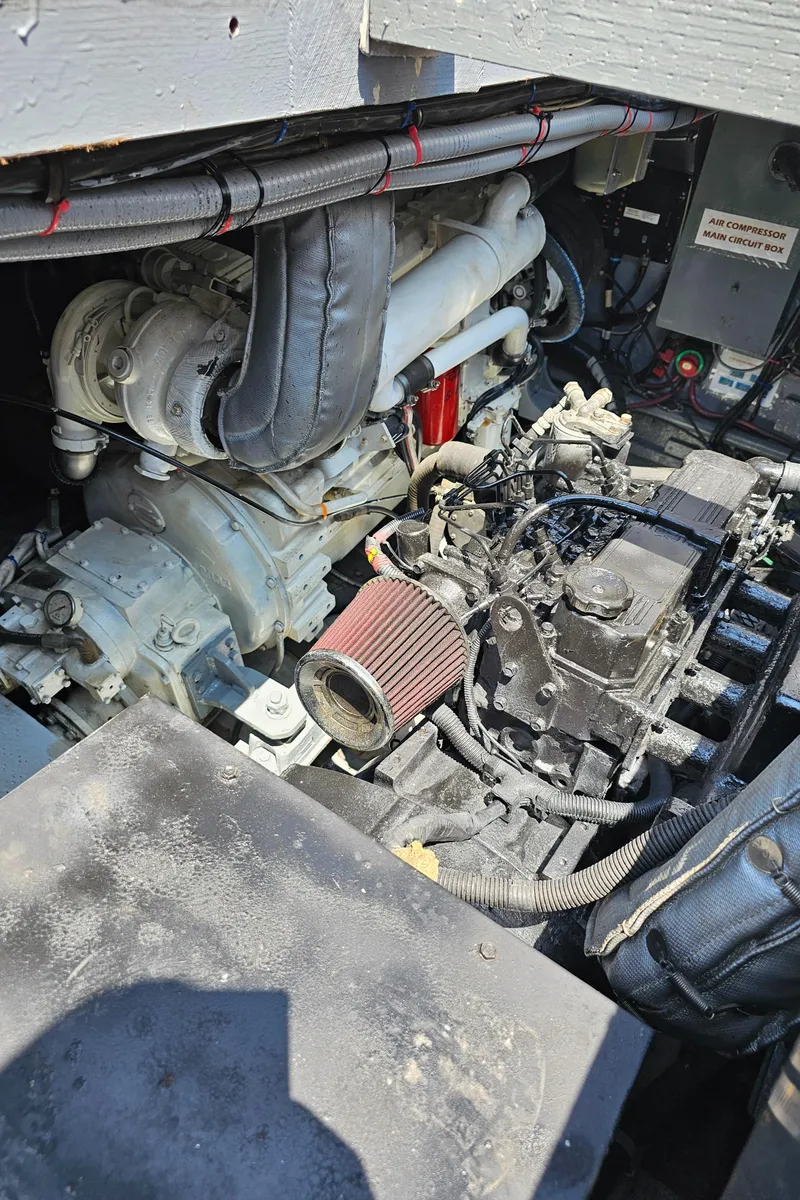 Slide: The Image of Engine compartment of a 1958 Ditmar & Donaldson Sport boat, showcasing mechanical components. - 15