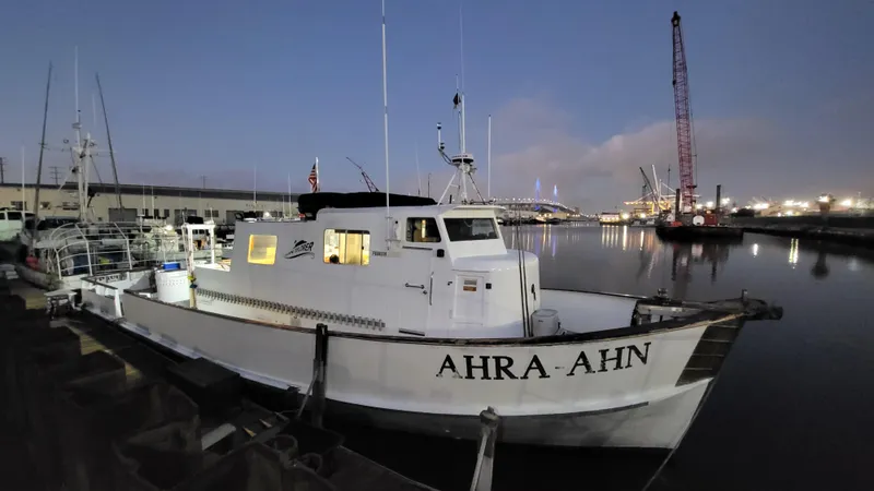 Slide: The Image of 1958 Ditmar & Donaldson sport boat docked at night, named "AHRA AHN". - 3