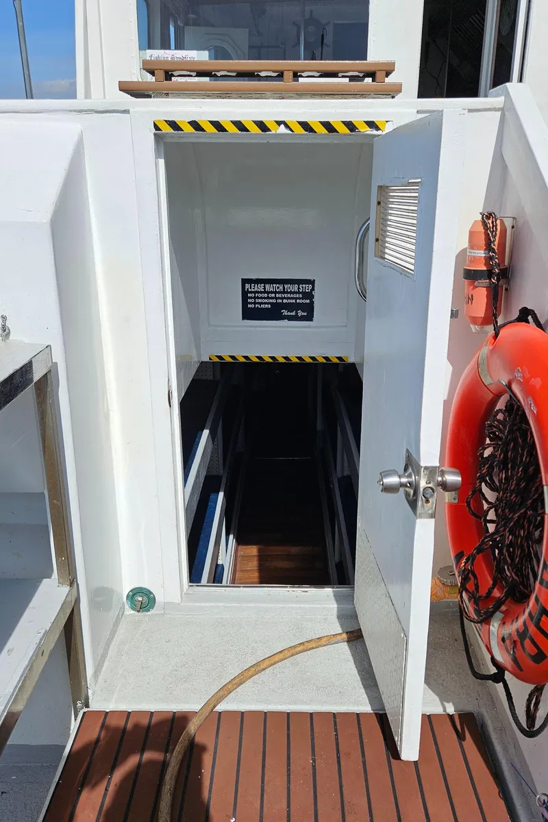 Slide: The Image of 1958 Ditmar & Donaldson sport boat with open cabin door and life preserver. - 9