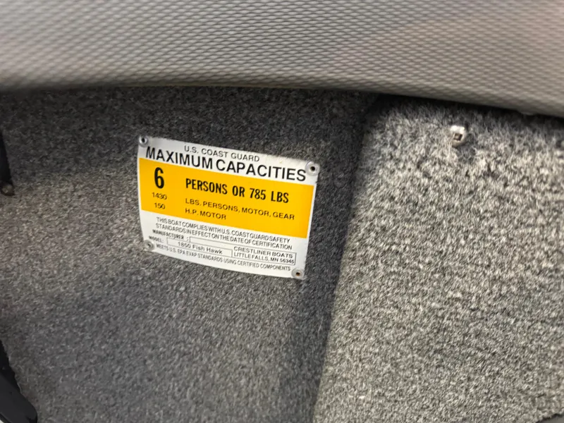 Slide: The Image of 2013 Crestliner 1850 Fish Hawk capacity label, 6 persons or 785 lbs limit. - 10