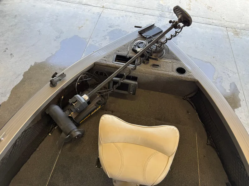 Slide: The Image of 2013 Crestliner 1850 Fish Hawk boat interior with trolling motor and seat. - 12