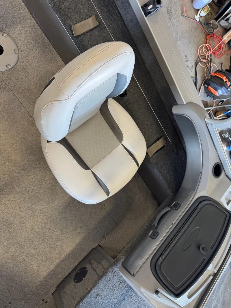 Slide: The Image of 2013 Crestliner 1850 Fish Hawk interior with gray seat and dashboard. - 8