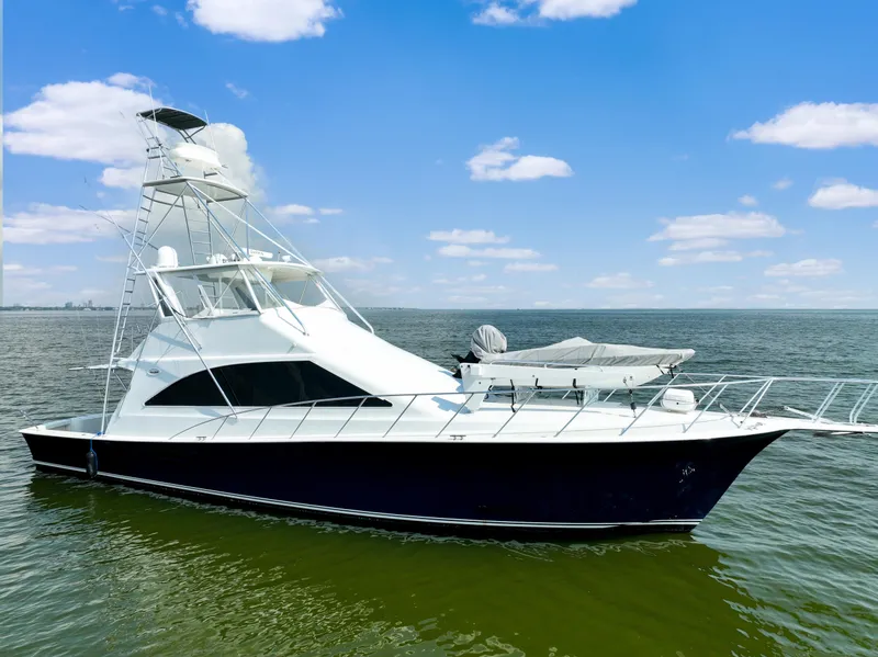 The Image of 1999 Ocean Yachts 60 Convertible boat on open water under blue sky. - 0