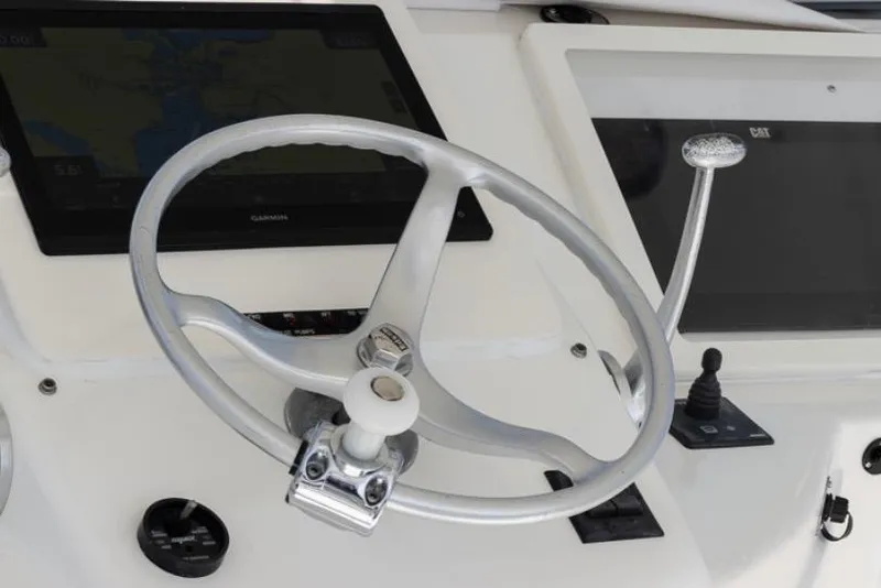 Slide: The Image of Steering wheel and controls of a 1999 Ocean Yachts 60 Convertible boat. - 6