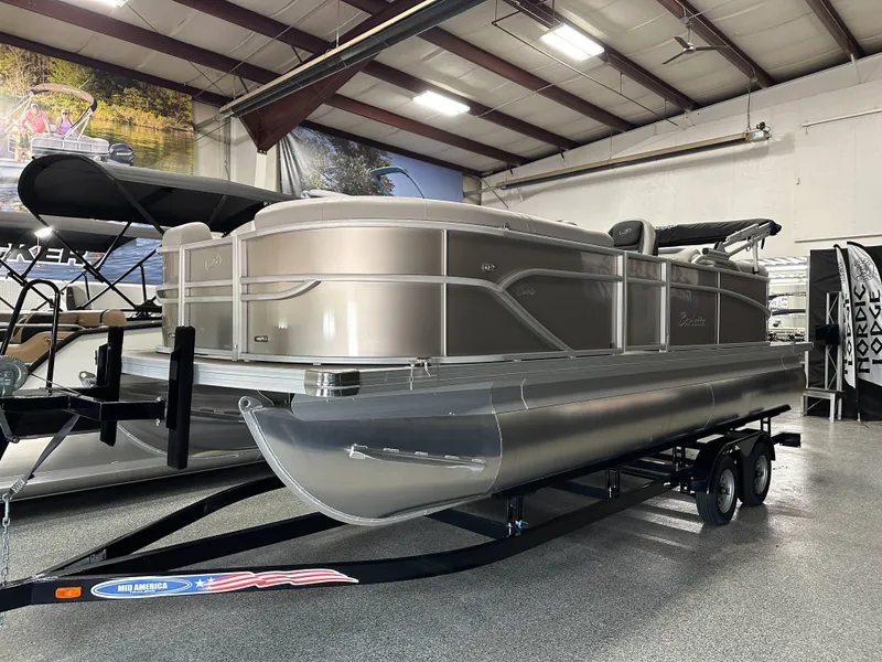 The Image of 2025 Barletta Cabrio 22QC pontoon boat on trailer in showroom. - 0