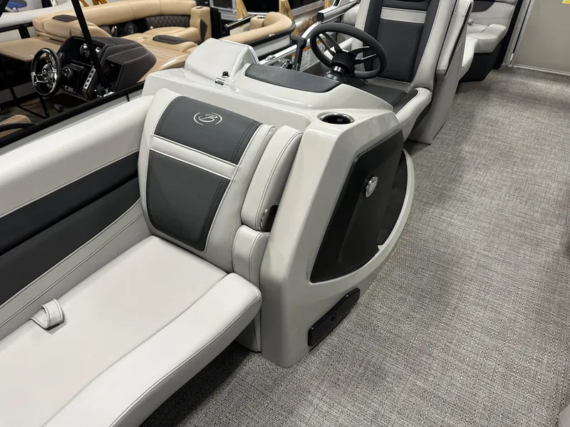 Slide: The Image of 2025 Barletta Cabrio 22QC interior with sleek seating and modern steering console. - 13