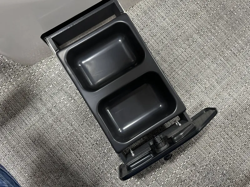 Slide: The Image of Cup holders in a 2025 Barletta Cabrio 22QC boat, on a textured surface. - 14