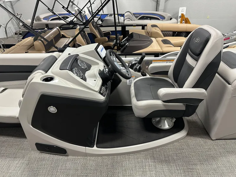Slide: The Image of 2025 Barletta Cabrio 22QC boat interior with captain's chair and control panel. - 16