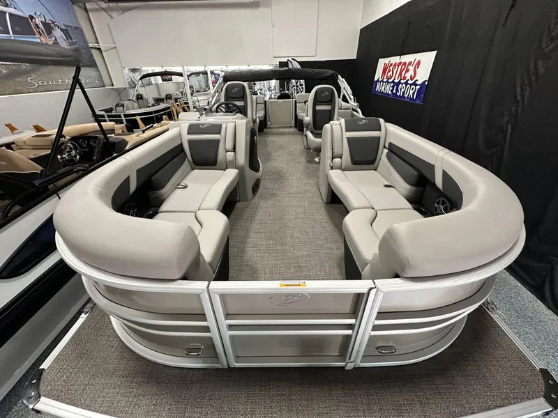 Slide: The Image of 2025 Barletta Cabrio 22QC pontoon boat with spacious seating in showroom. - 6
